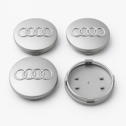 Zestaw 4 srebrnych dekielków do felg Audi 68mm ułożonych kaskadowo na jasnym tle.